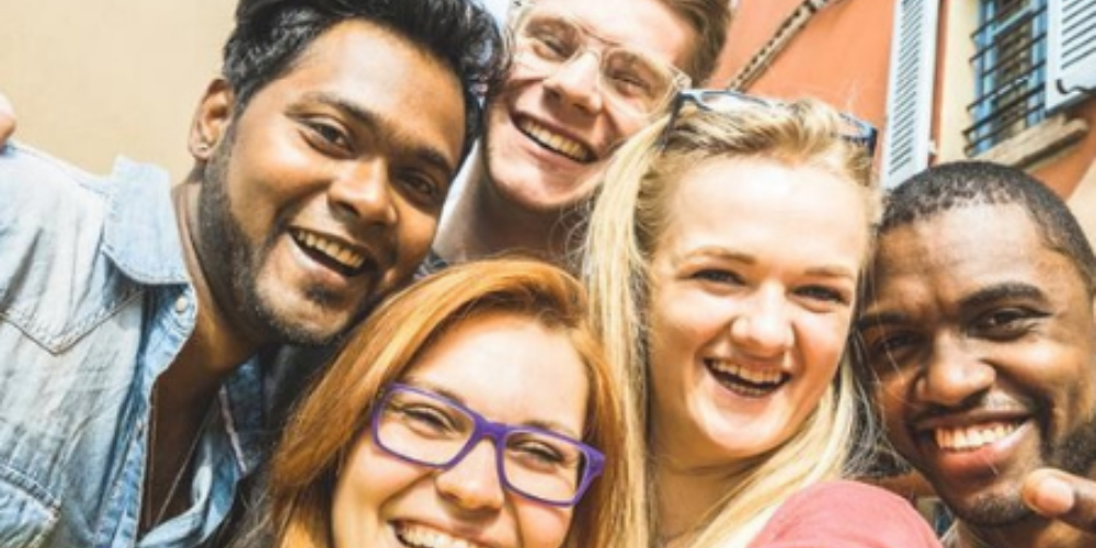 Five students pose for a selfie.