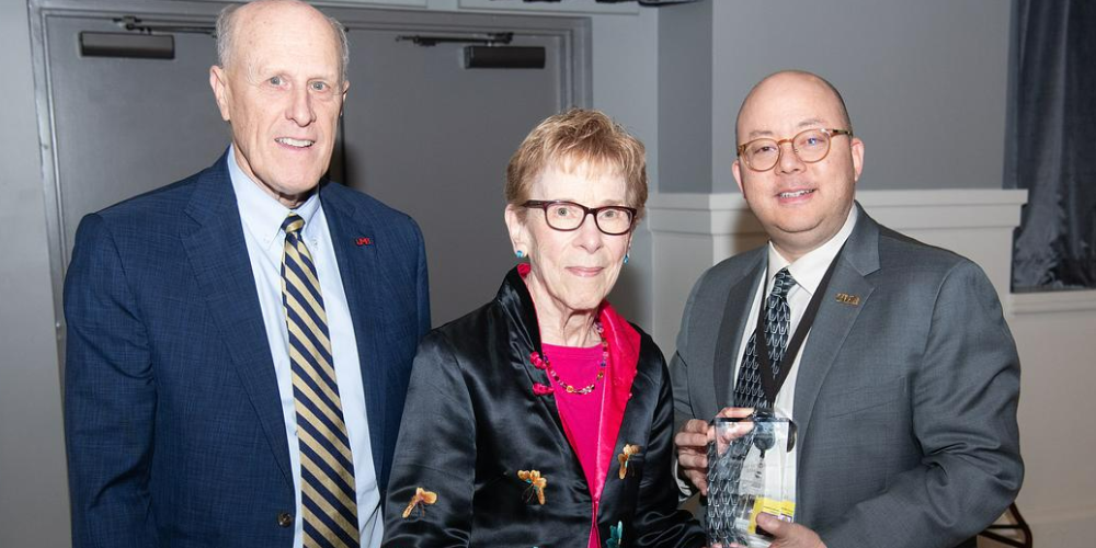 Dr. Bruce Jarrell, Dr. Leslie Glickman, and Dr. Kenneth Wong pose with an award