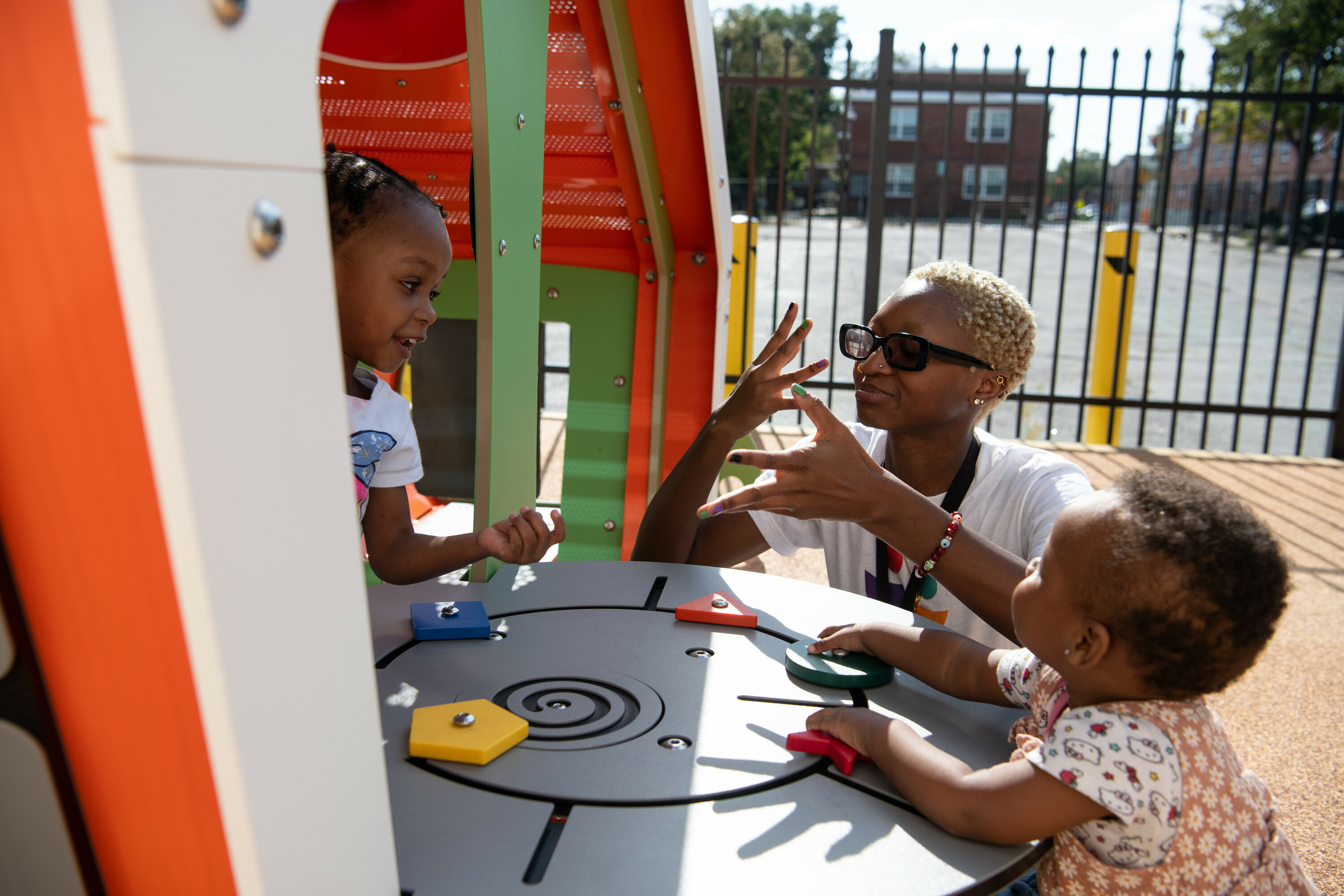 Social work student at a park with children