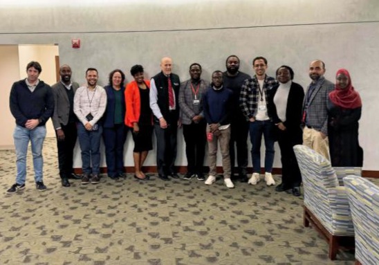 International Operations poses with Dr. Bruce Jarrell