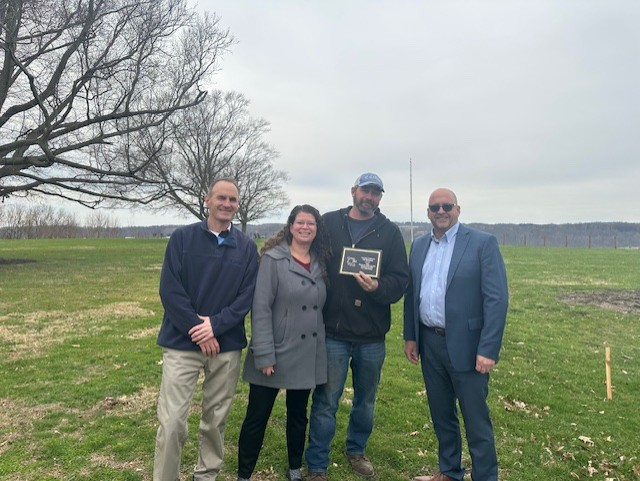 John Biedenback poses with colleagues