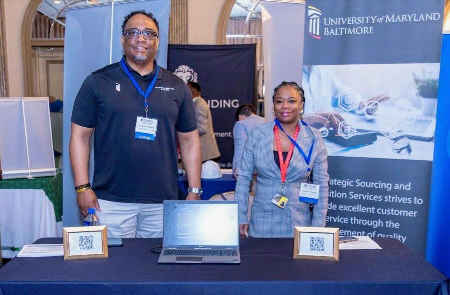 Arnold Jolivet and colleague Sheneka Nichols work an event to recruit small, minority, or woman owned contractors