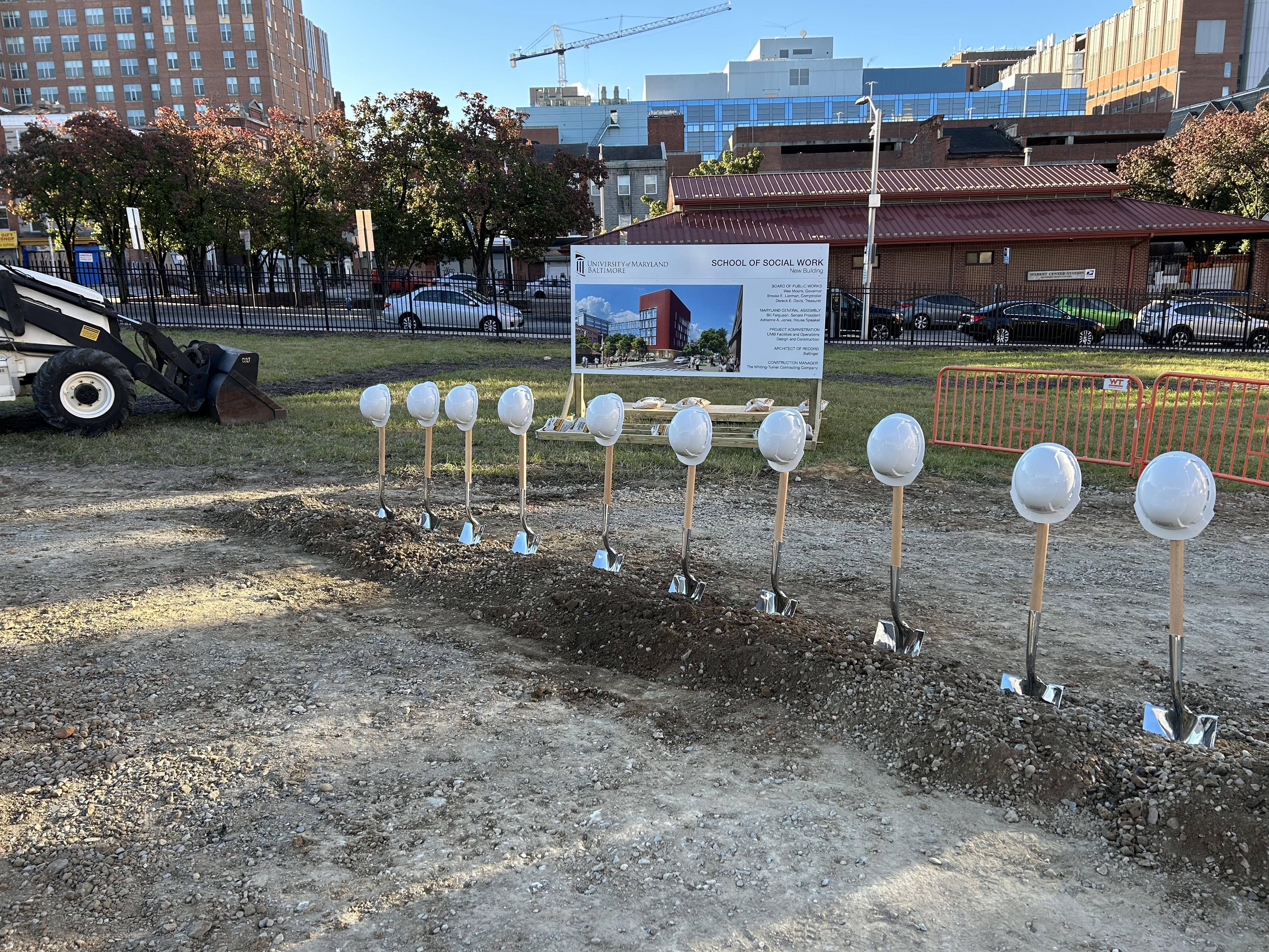 groundbreaking site with shovels and hard hats