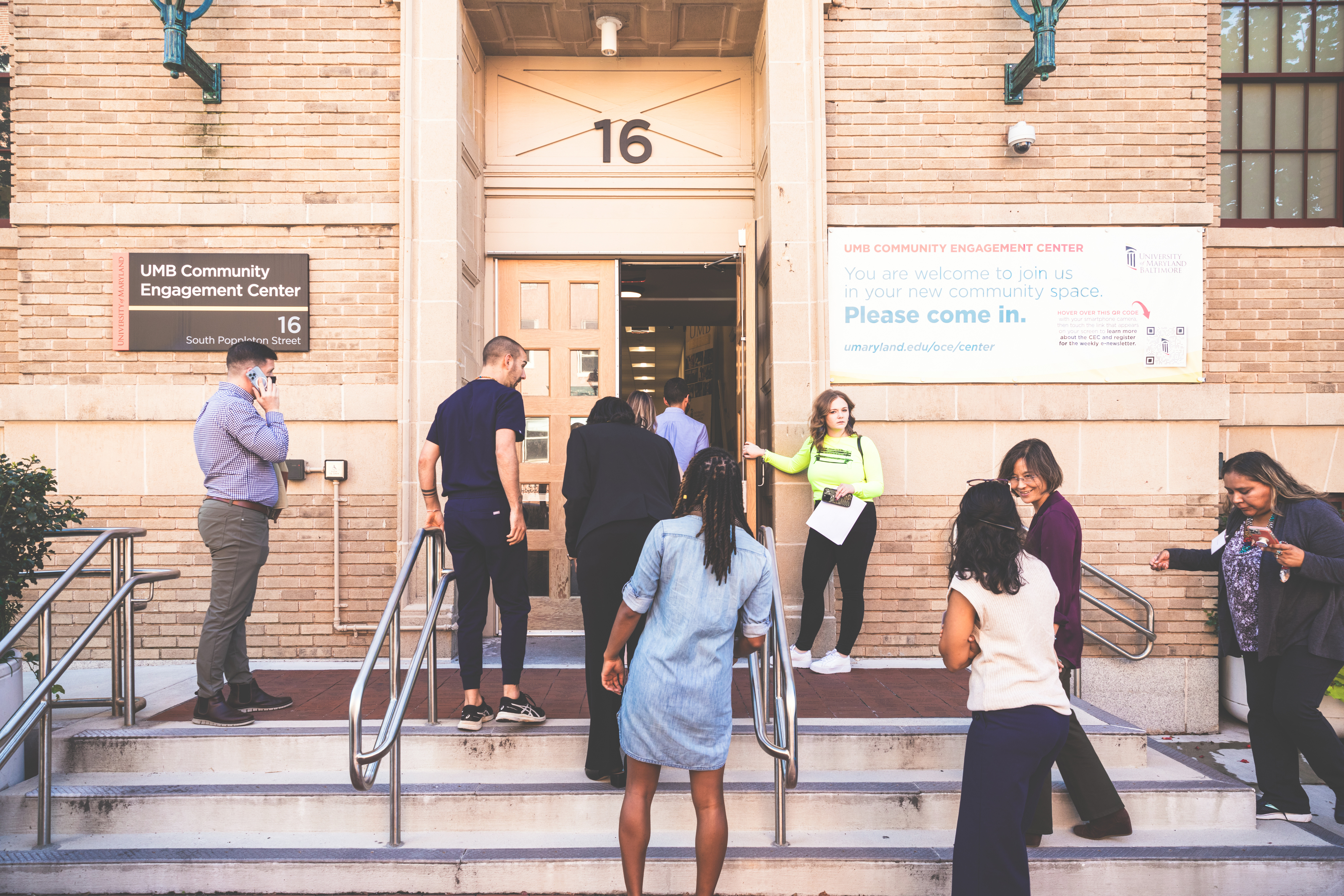 People walking into the Community Engagement Center