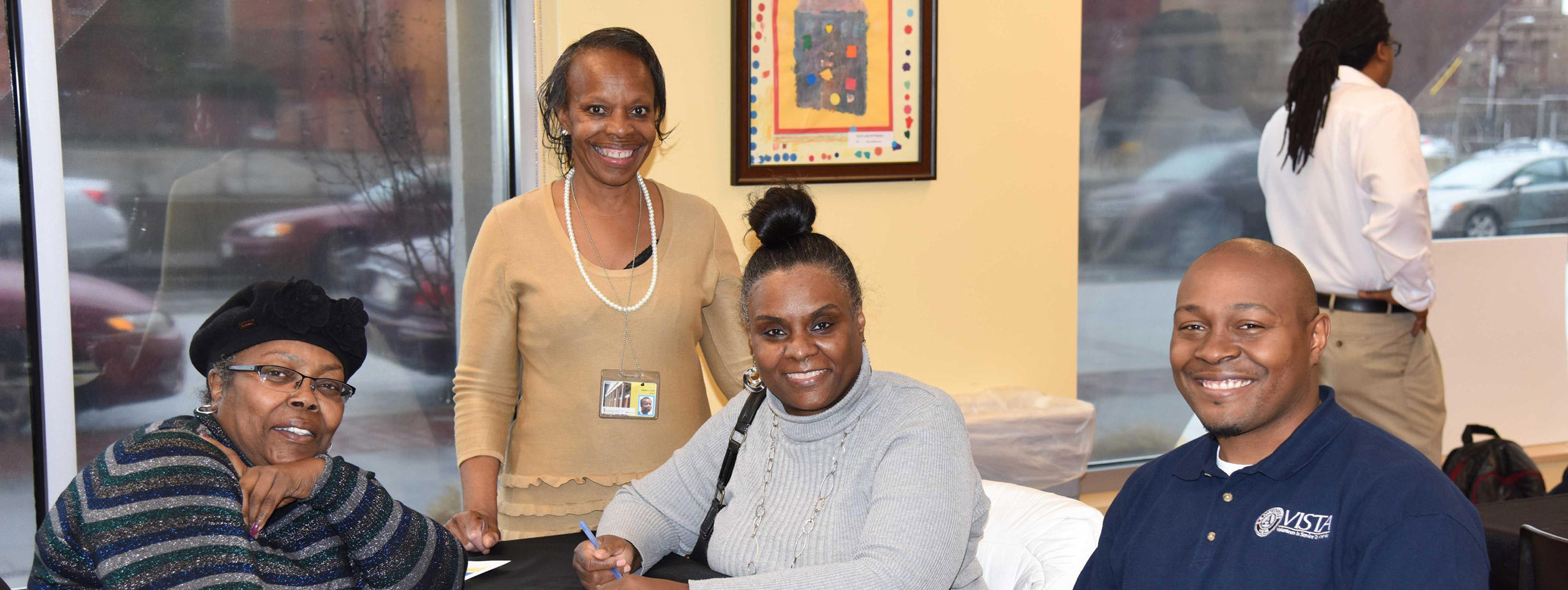 a small group gathers for a photo