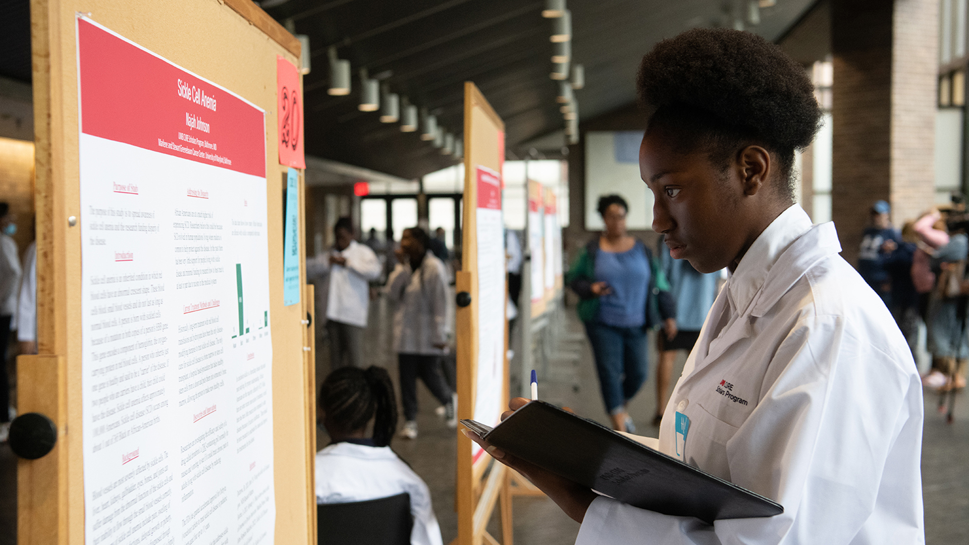 A CURE Scholar reflects on her project poster.