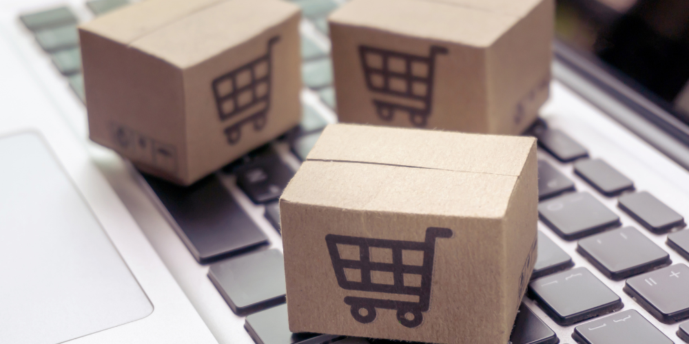 Shipping boxes on a laptop keyboard