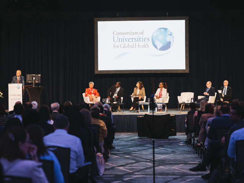Speakers onstage at CUGH Conference,