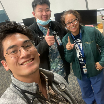 Three people pose for a selfie