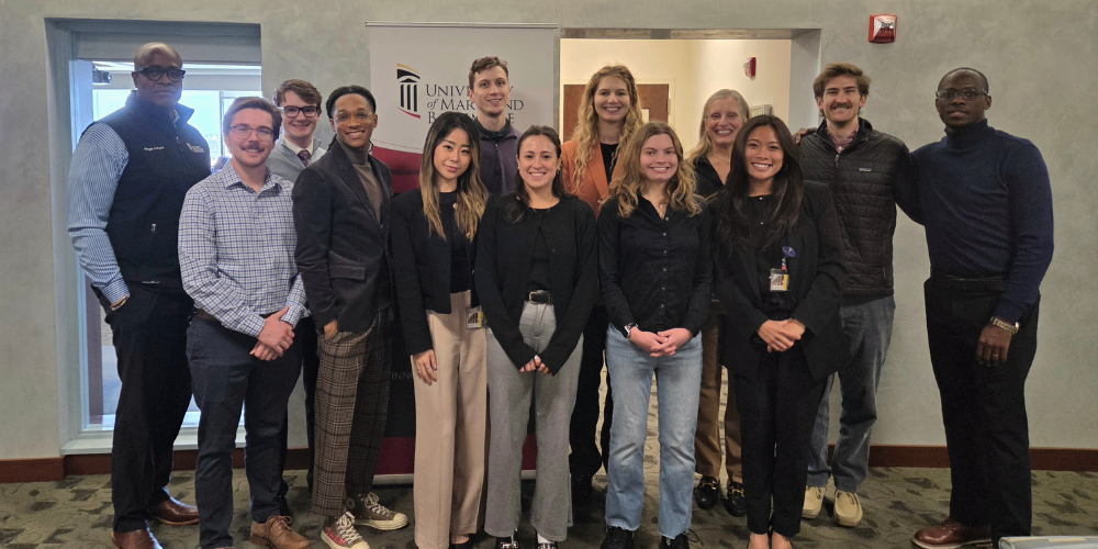 The 2025 Provost's Global Scholars pose for a group photo with Provost Dr. Roger Ward