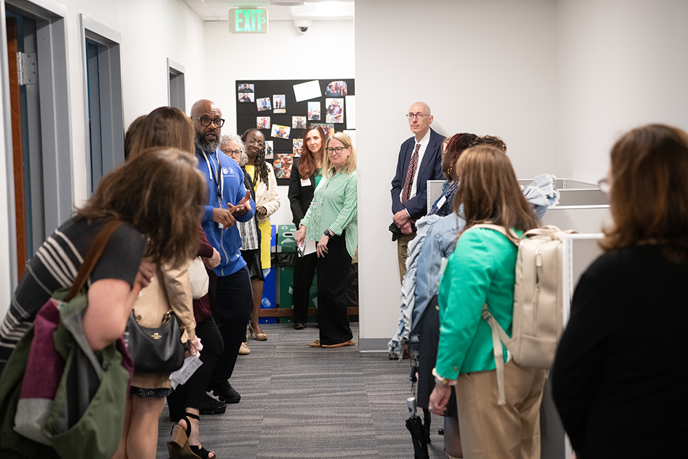 People lined up in a hallway