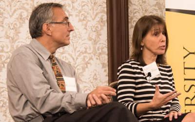 Christopher Welsh, MD, associate professor at the University of Maryland School of Medicine, listens to remarks by fellow panelist Bethany DiPaula, PharmD, professor at the UM School of Pharmacy.