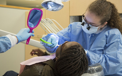 One of the UMB CURE Scholars is treated by students and faculty of the University of Maryland School of Dentistry on Feb. 18, 2017.