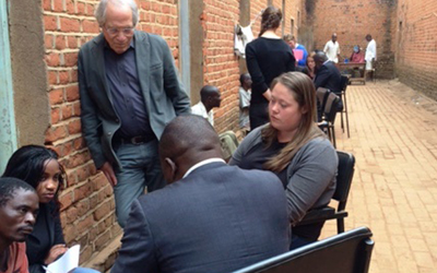 Maryland Carey Law Professor Douglas Colbert, JD, standing, collaborates with students from UMB and from Chancellor College of Law during a visit to bail clients in Malawi's Zomba Central Prison. 