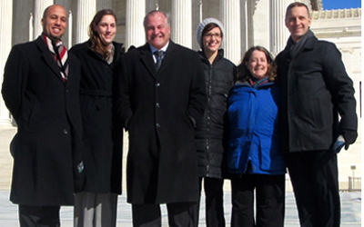Maryland Carey Law alumni with Maryland Carey Law Professor Robert Percival in front of the U.S. Supreme Court