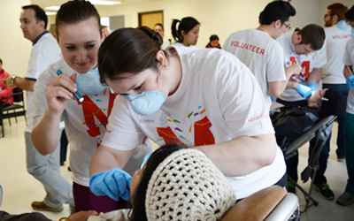 Volunteers perform oral cancer screenings in College Park