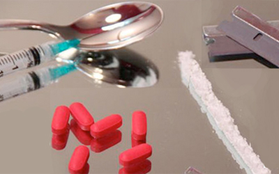 drugs and paraphernalia on table