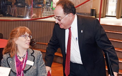 Dr. Jay A. Perman engages with a School of Nursing employee.