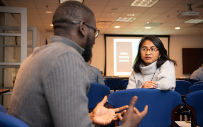 Uriel Jean-Baptiste (right) and Saovleak Khim (left), both participants in UMB's STAR-PREP Program, share stories about their mentors during a mentor-mentee workshop.
