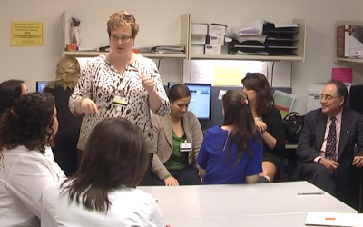 Jill A. Morgan, PharmD, BCPS, BCPPS, engages students from the School of Pharmacy and other UMB schools during the President’s Interdisciplinary Gastrointestinal Clinic at the University of Maryland Medical Center.