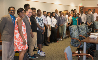 The YouthWorks students pose with program leaders, UMB President Jay Perman and Cong. Elijah Cummings