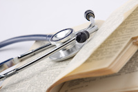 a stethoscope on a textbook